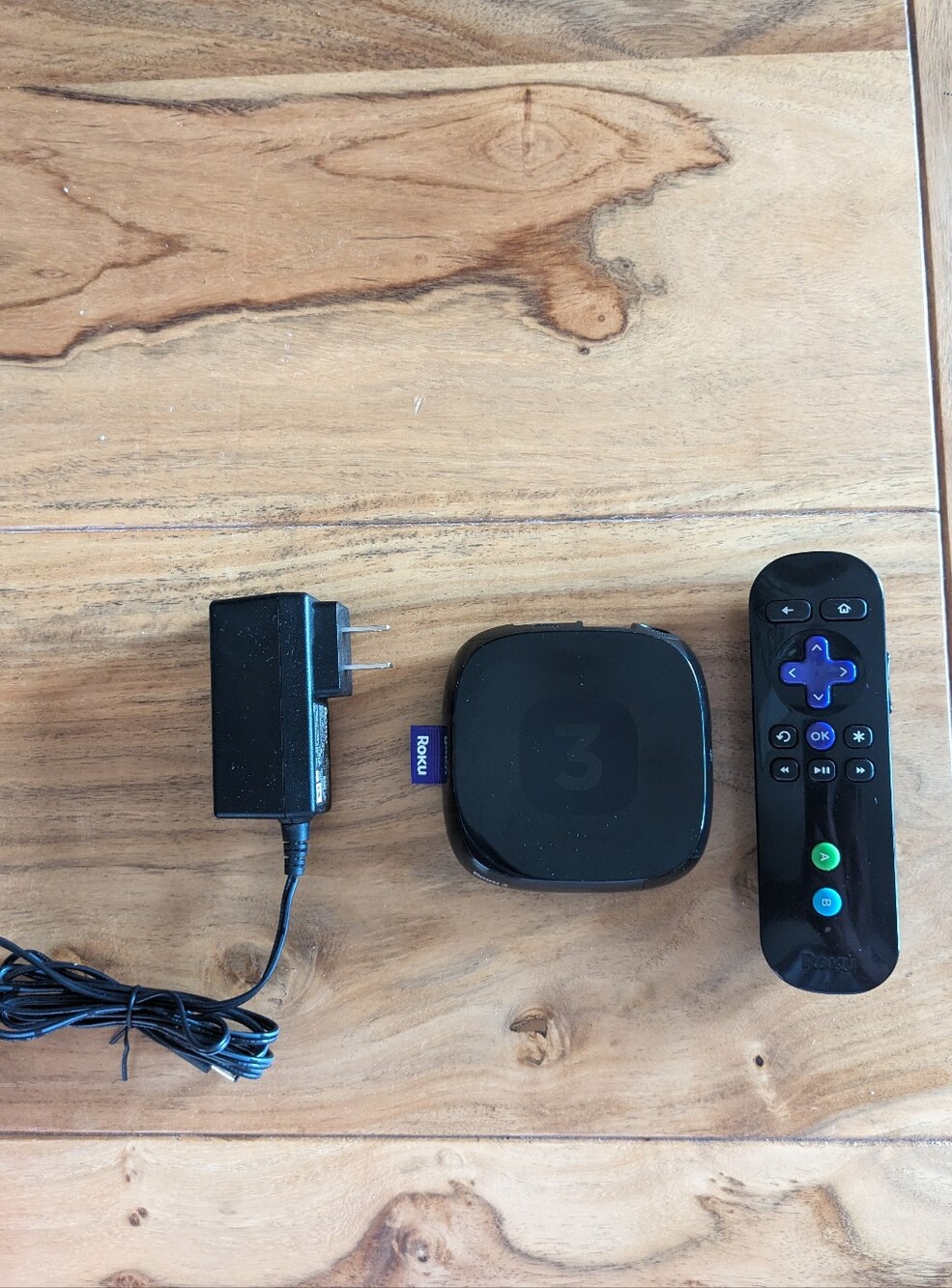 Roku 3 HDTV streaming box with power supply and remote